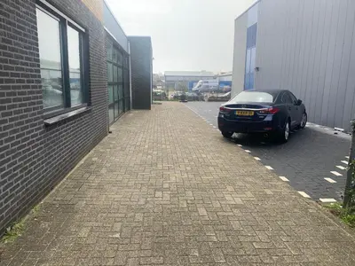 a black car parked next to a building at Apartments Zaanse Schans and Amsterdam in Wormer