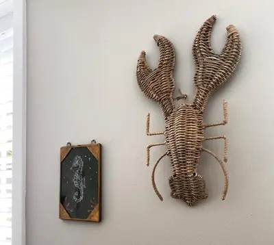 a skeleton hanging on a wall next to a clock at Fabel aan Zee in Zandvoort