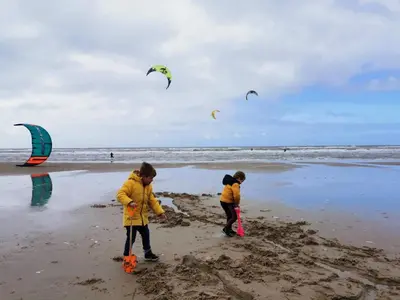 two children playing in the sand on the beach at ''Op Stok