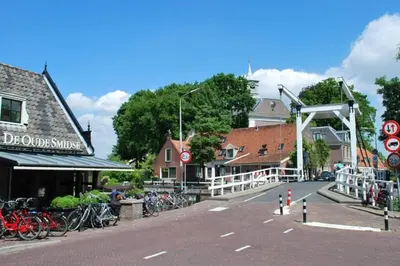 a street with bikes parked on the side of the road at Villa Amsteldijck (8km from Amsterdam) in Ouderkerk aan de Amstel