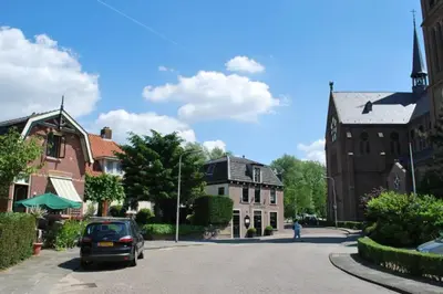 a car parked on a street in a town at Villa Amsteldijck (8km from Amsterdam) in Ouderkerk aan de Amstel