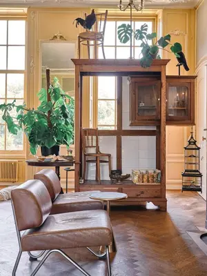 a living room with a couch and a table at Eco Hotel Plantage Rococo in Velsen-Zuid