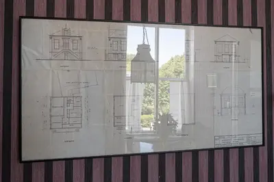 a drawing of a building in a window at B&B 't Raethuys in Dirkshorn