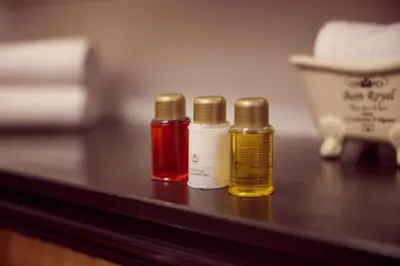 three bottles of essential oils sitting on a table at Realeneiland Bed & Breakfast in Amsterdam