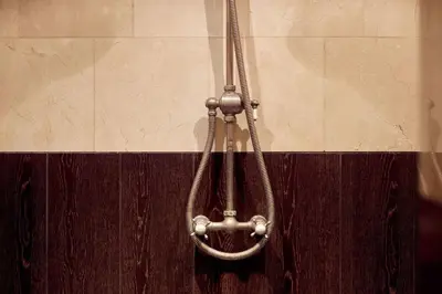 a metal shower head hanging on a wall at Realeneiland Bed & Breakfast in Amsterdam