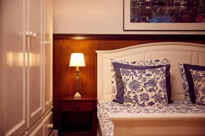 a bedroom with a bed and a lamp on a night stand at Realeneiland Bed & Breakfast in Amsterdam