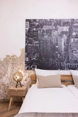 a bedroom with two beds and a painting on the wall at Passage - Spacious Suite in Historic Centre in Haarlem