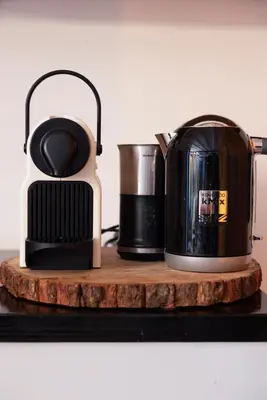 two coffee makers sitting on a wooden shelf at Passage - Spacious Suite in Historic Centre in Haarlem