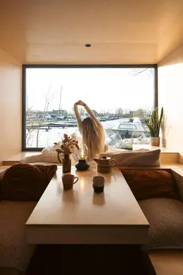 a room with a bird statue in front of a window at Zwier, de Vrijhaven in Vinkeveen