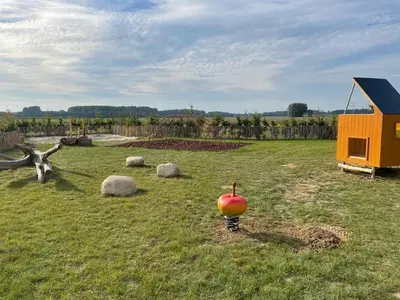an apple sitting in the middle of a field at Camping de Vliert in Bunnik