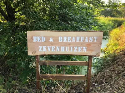 a sign that reads bed and breakfast zimbabwe at Bed & Breakfast Zevenhuizen in Zevenhuizen