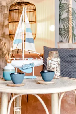 a table with a toy sailboat on top of it at Oasis Studio- Free Parking in Zandvoort