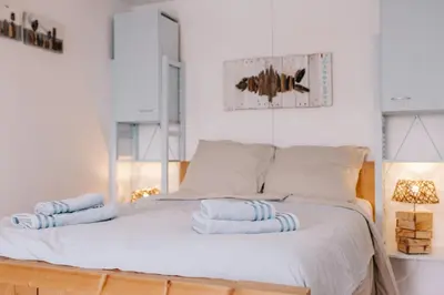 a bedroom with a bed with towels on it at De Jutter - Zandvoort Free Parking in Zandvoort