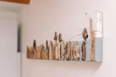 a bunch of pieces of wood hanging on a wall at De Jutter - Zandvoort Free Parking in Zandvoort