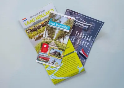 two magazines sitting next to each other on a table at Tulpenhoek in Akersloot