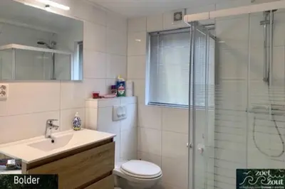 a bathroom with a toilet and a sink and a shower at Wellness Bungalow Bolder 5p Amsterdam and the beach in Opmeer