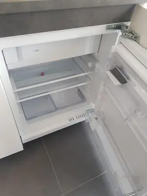 an empty white refrigerator with its door open at Mara's Place in Zandvoort