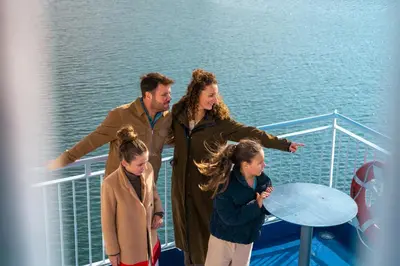 a group of people standing on a cruise ship at DFDS Ferry - Amsterdam to Newcastle in IJmuiden