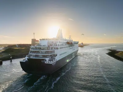 a cruise ship in the water at sunset at DFDS Ferry - Amsterdam to Newcastle in IJmuiden