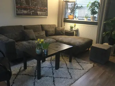 a living room with a couch and a coffee table at Beemster Experience in Middenbeemster