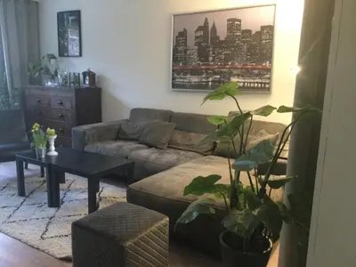 a living room with a couch and a table at Beemster Experience in Middenbeemster