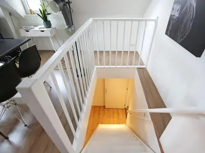 a white staircase with a white stair case at Appartementen Purmerend B in Purmerend