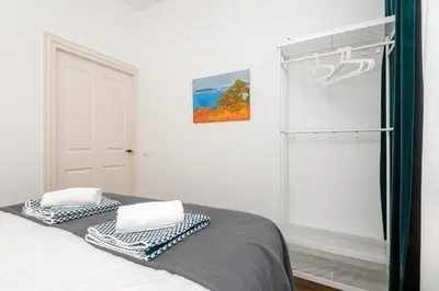 a bedroom with a bed with two pillows on it at Charming Apartments in Alkmaar