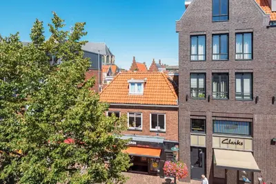 a group of tall buildings in a city at Charming Apartments in Alkmaar