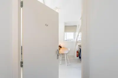 an open door to a room with a table at Charming Apartments in Alkmaar