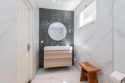 a bathroom with a sink and a mirror at Charming Apartments in Alkmaar