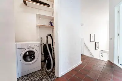 a laundry room with a washing machine in it at Zandvoort North Spacious 2 bedroom apartment in Zandvoort