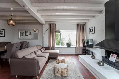 a living room with a couch and a coffee table at Zandvoort North Spacious 2 bedroom apartment in Zandvoort