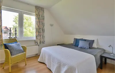 a bedroom with a bed and a window at Horsterhuis in Zeewolde