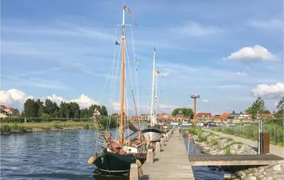 a boat is docked at a dock in the water at Horsterhuis in Zeewolde