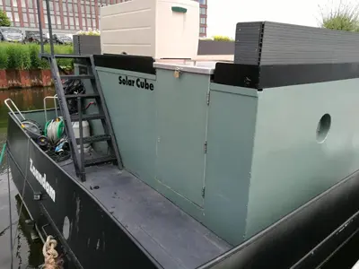 a boat with a ladder on the side of it at loft boat in Amsterdam