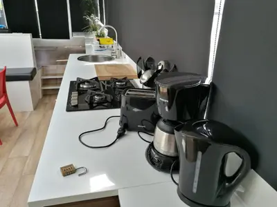 a kitchen with a counter with a coffee maker on it at loft boat in Amsterdam