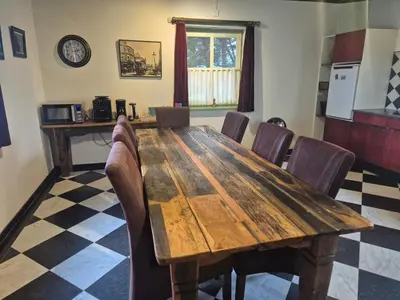 a dining room with a wooden table and chairs at B&B De Hooiberg Edam-Volendam in Edam