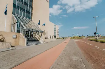 an empty street in front of a building at Beach Suite Sand in Zandvoort
