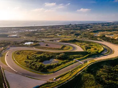 an aerial view of a road with the ocean in the background at Beach Suite Sand in Zandvoort