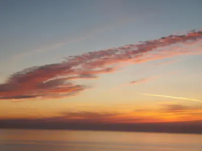 a cloudy sky at sunset over the ocean at Beach Studio, No Sea View, Public Paid Parking in Zandvoort