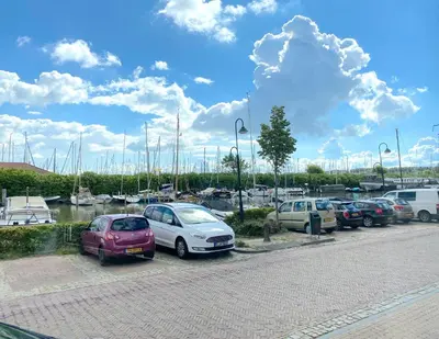a bunch of cars parked in a parking lot at Who's Anton for you or two, Monnickendam near Amsterdam in Monnickendam