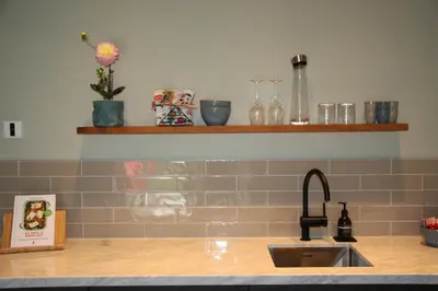 a kitchen with a sink and a counter top at Luxe B&B 