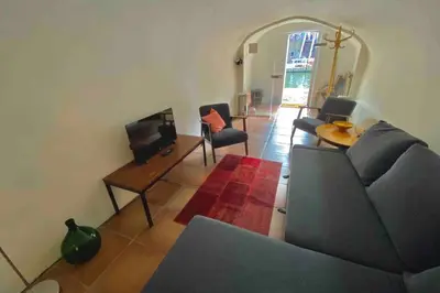 a living room with a couch and a table at Werfkelder aan de Oudegracht in Utrecht