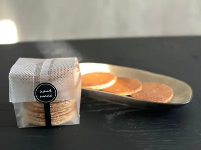 a box of crackers next to a plate of pancakes at Style Gardenhouse Zwanenburg near AMSTERDAM, HAARLEM, ZANDVOORT in Zwanenburg
