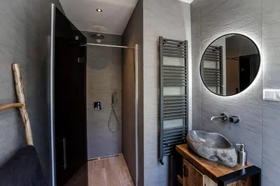 a bathroom with a sink and a mirror at Good Vibes Romantic Studio incl free private parking in Zandvoort