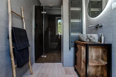 a bathroom with a shower and a sink at Good Vibes Romantic Studio incl free private parking in Zandvoort