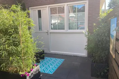 a front door of a house with plants at Good Vibes Romantic Studio incl free private parking in Zandvoort