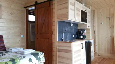 a kitchen in a tiny house with a sink at Mar&Mar Houseboat Studio in Amsterdam