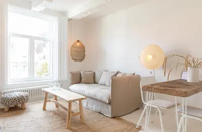 a living room with a couch and a table at Luttik in Alkmaar