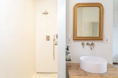 a bathroom with a white sink and a mirror at Luttik in Alkmaar